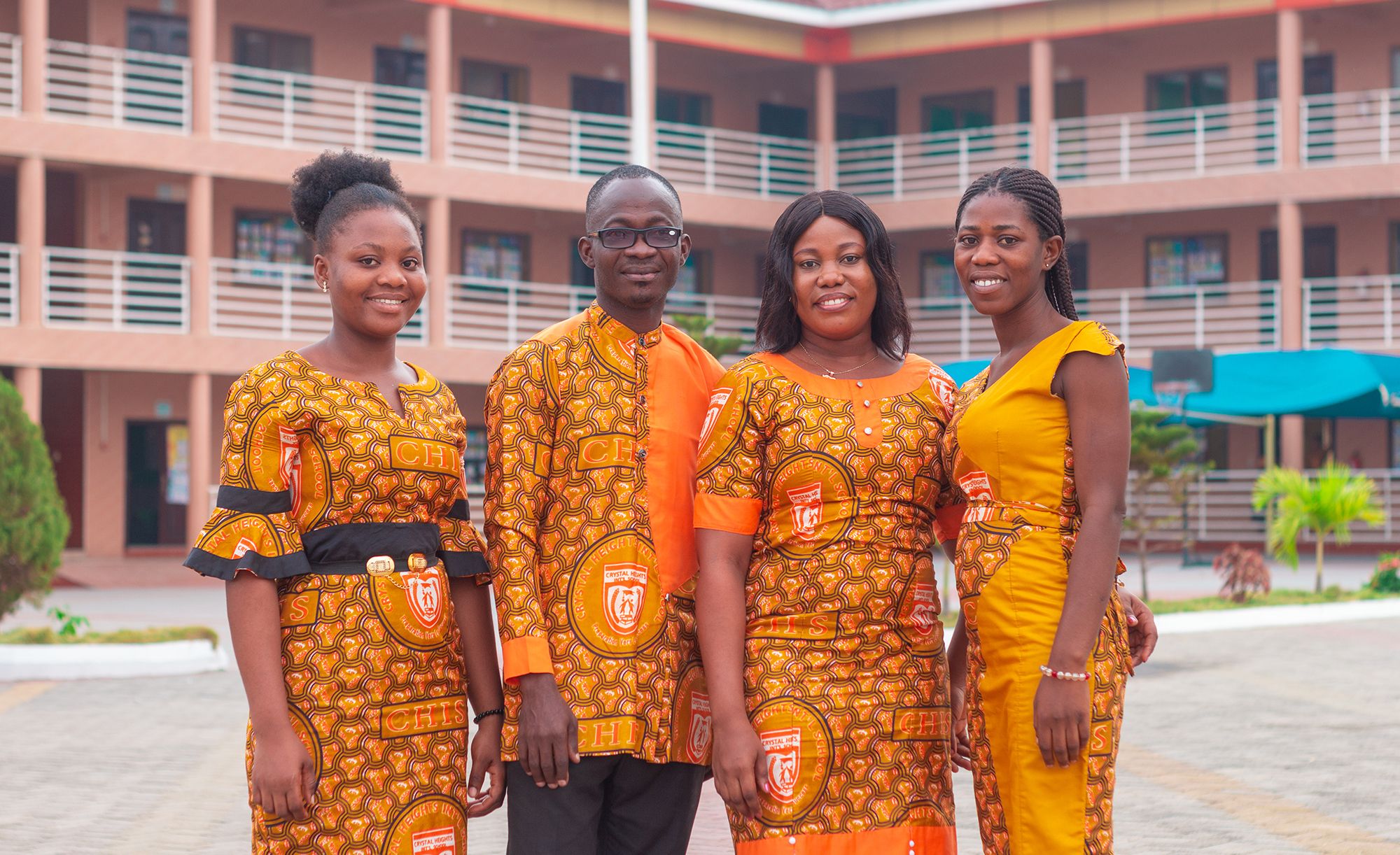 Crystal Heights staff in the school's kente uniform on campus