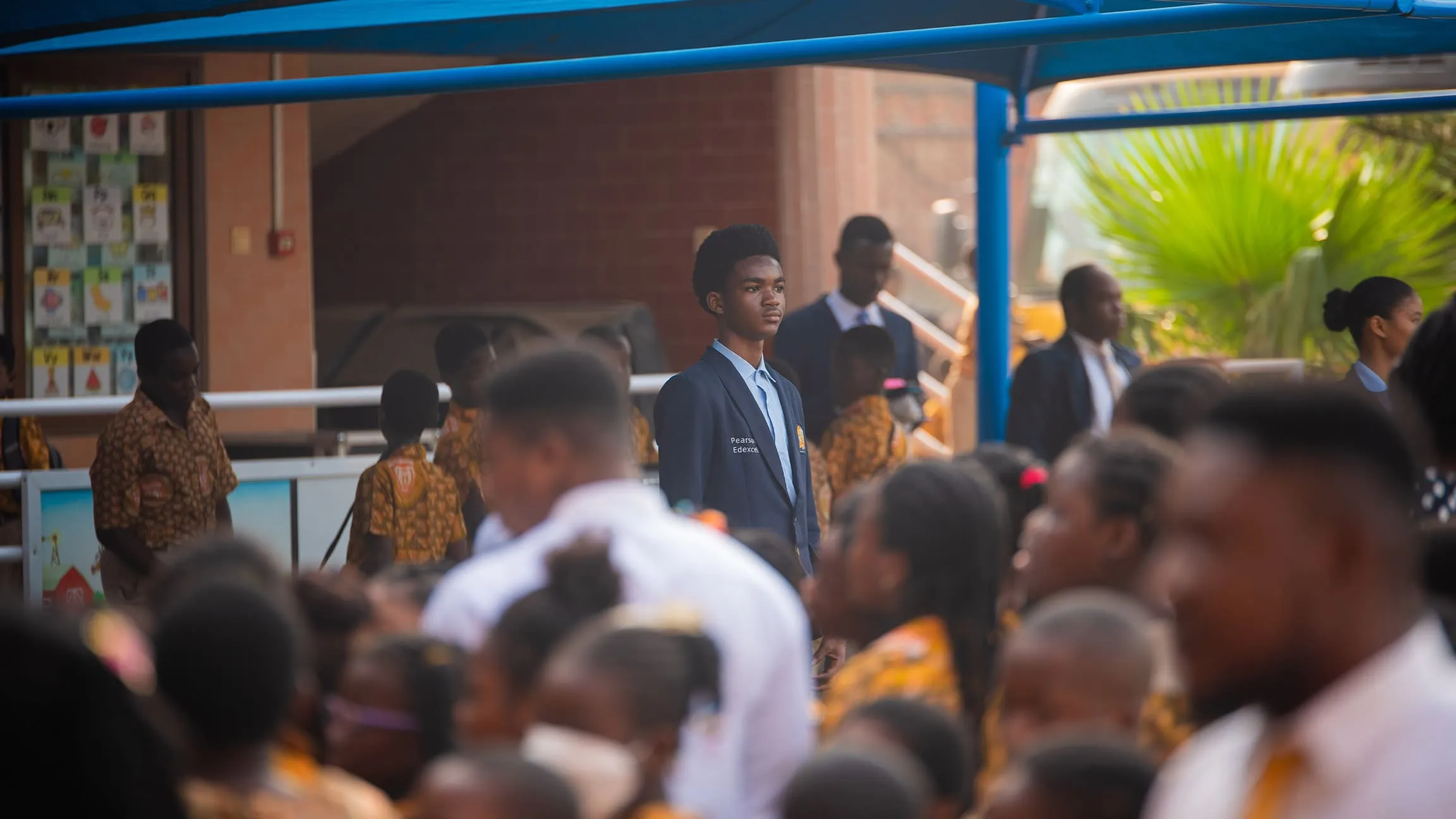 A Crystal Heights senior in the school's Pearson Edexcel blazer at morning assembly