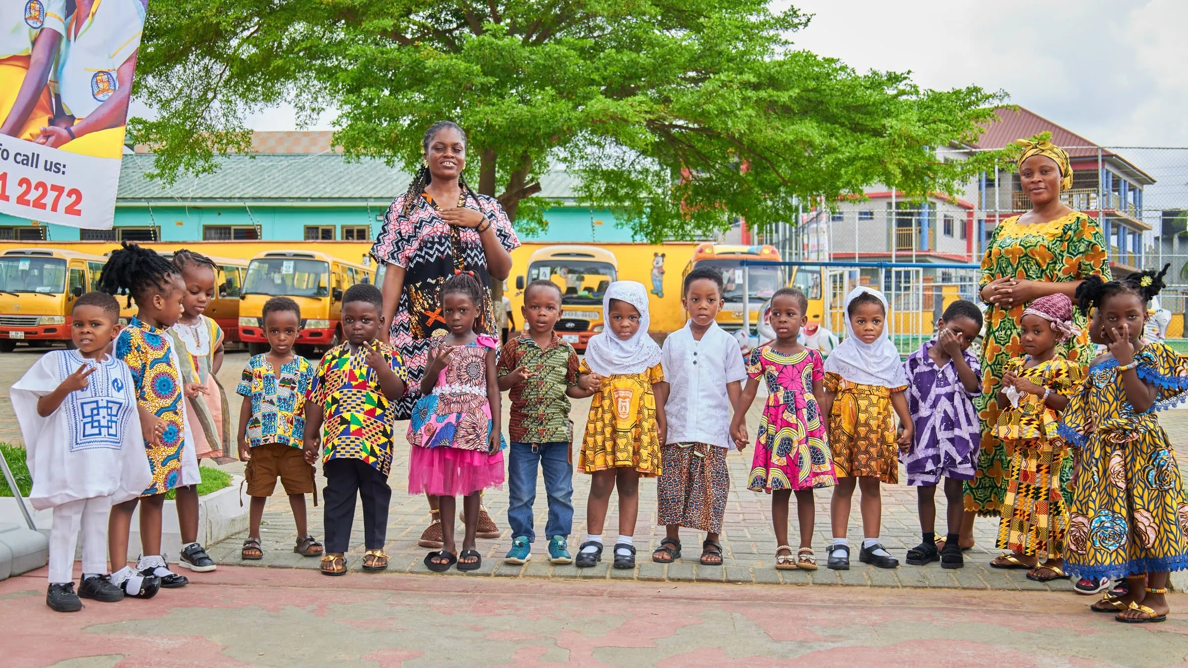 Crystal Heights pupils lined up outside in traditional Ghanaian dress on Cultural Day