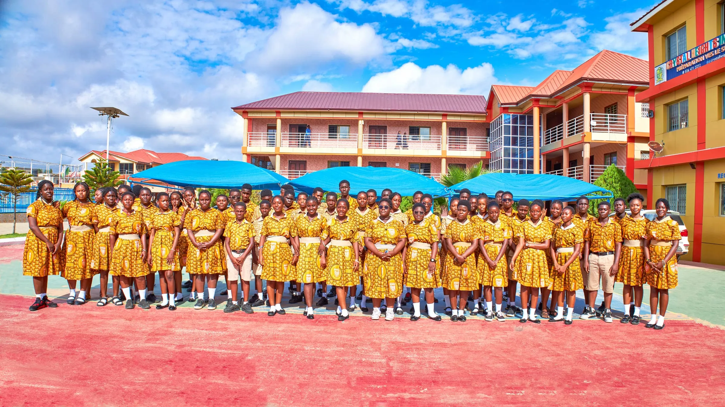 The Crystal Heights JHS3 year group assembled outside the school blocks in 2026