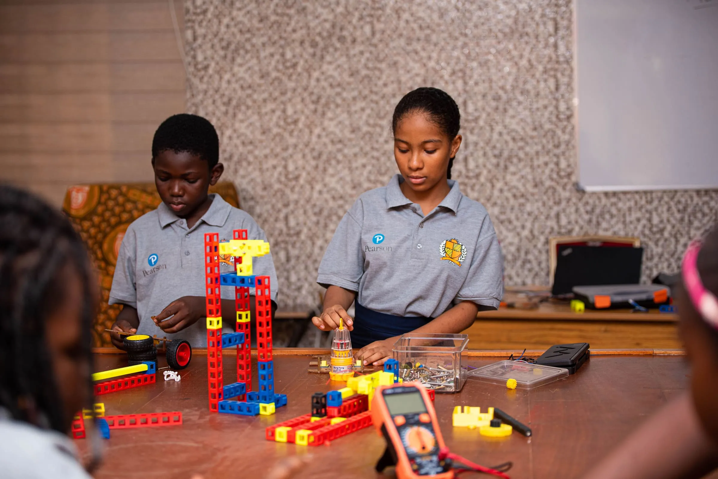 Students building models in the robotics studio